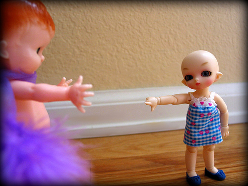 It was the Knickerbocker Rattle Doll in the living room with the purple boa! by Didi Wood